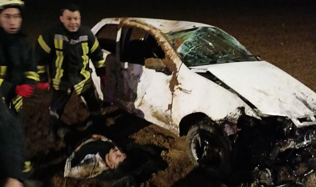 Sürücü takla atan otomobilin altında kaldı