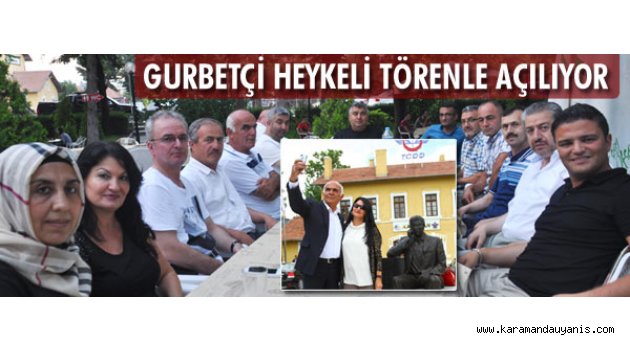 'Tahta valizli adam heykeli'